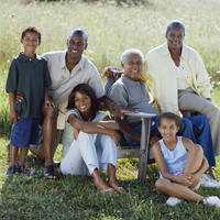 Smiling Family Posing in Field